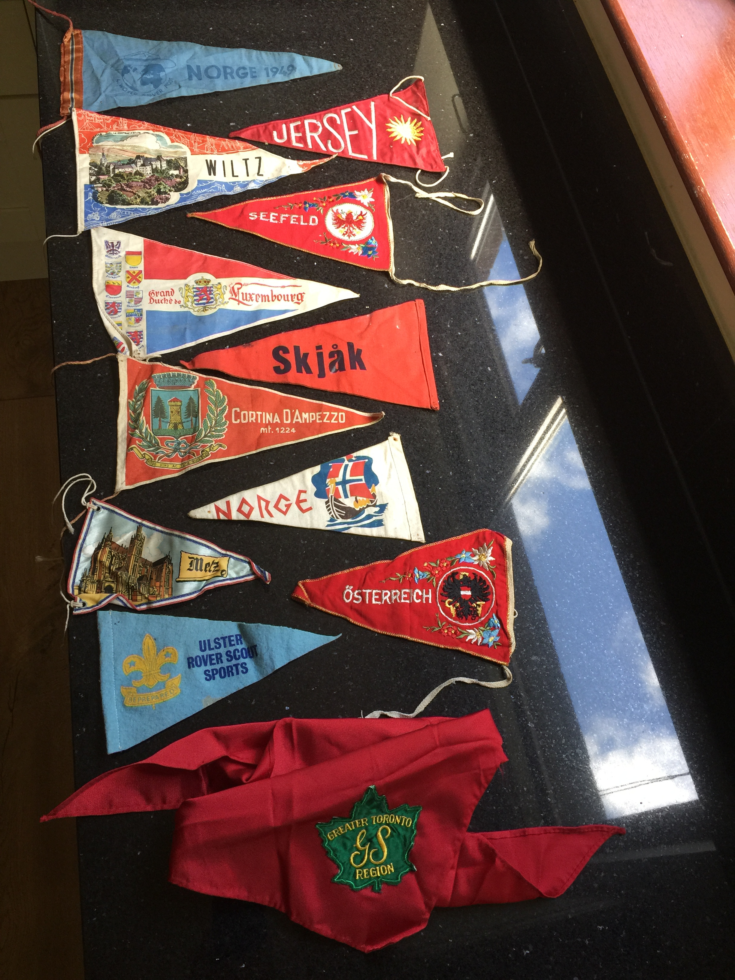 11 pennants and one Scouting necker from various places.